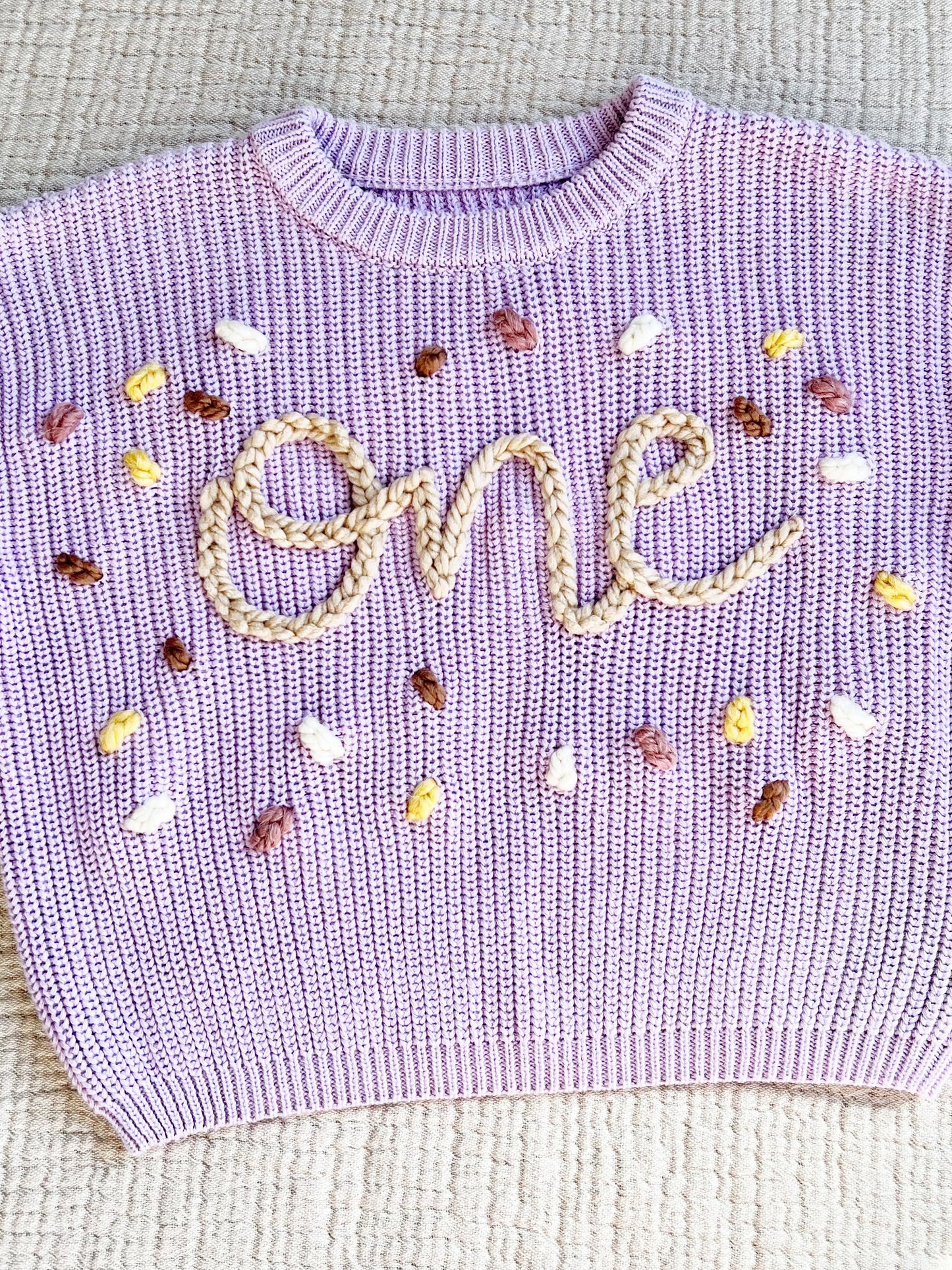 "ONE" CONFETTI EMBROIDERED SWEATER