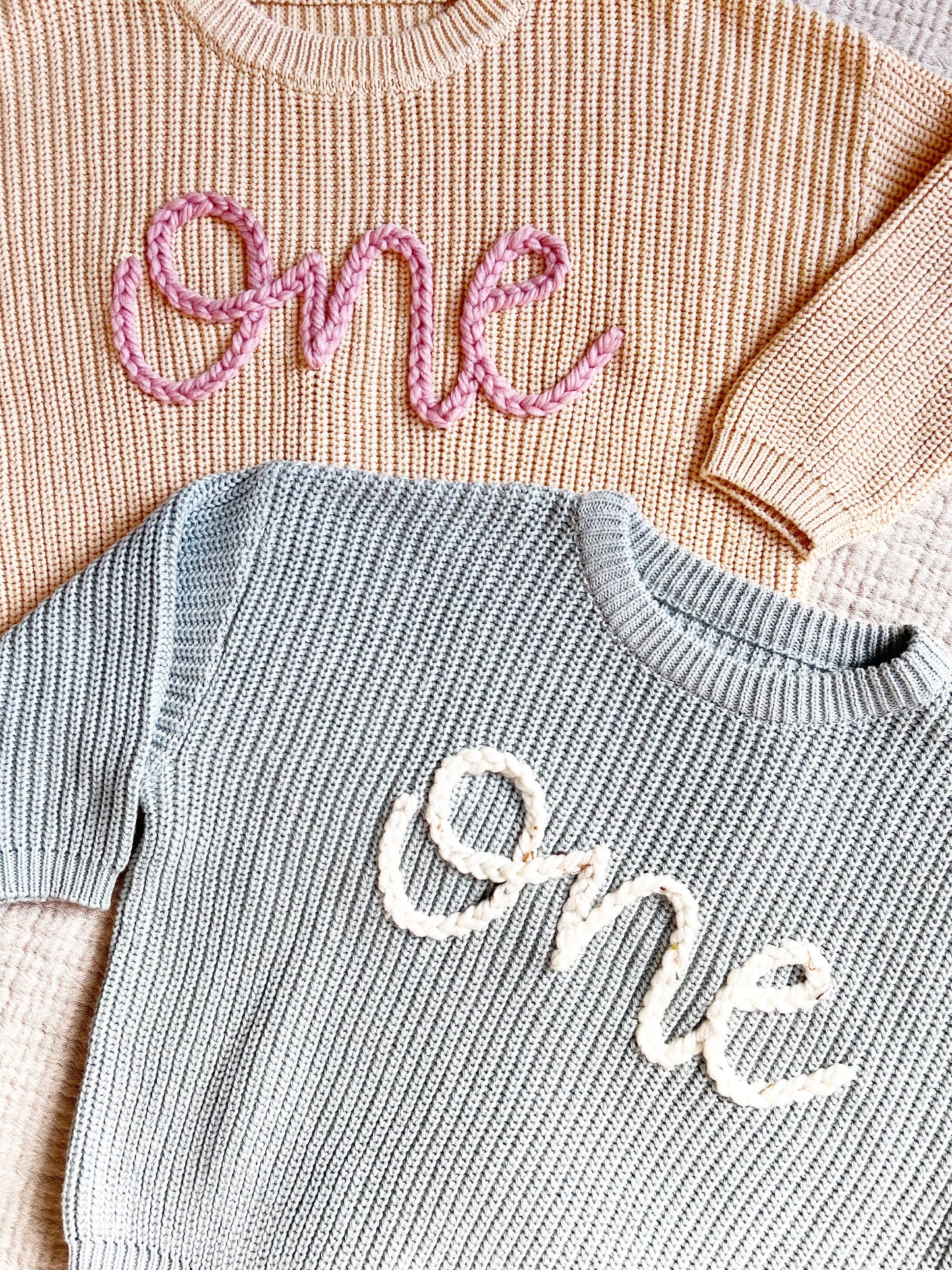 "ONE" EMBROIDERED SWEATER